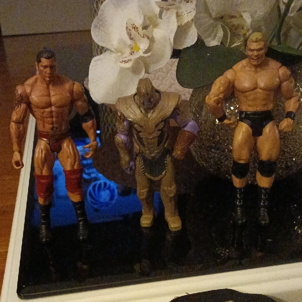 WWE Action Figures with Red, Black, and Purple Accents